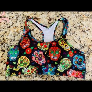 New XL women’s sports bra razor back. Mard Gras colorful skulls